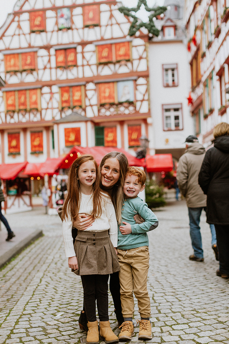 A mother poses with her children for these Bernkastel-Kues Christmas mini sessions near Kaiserslautern, Germany