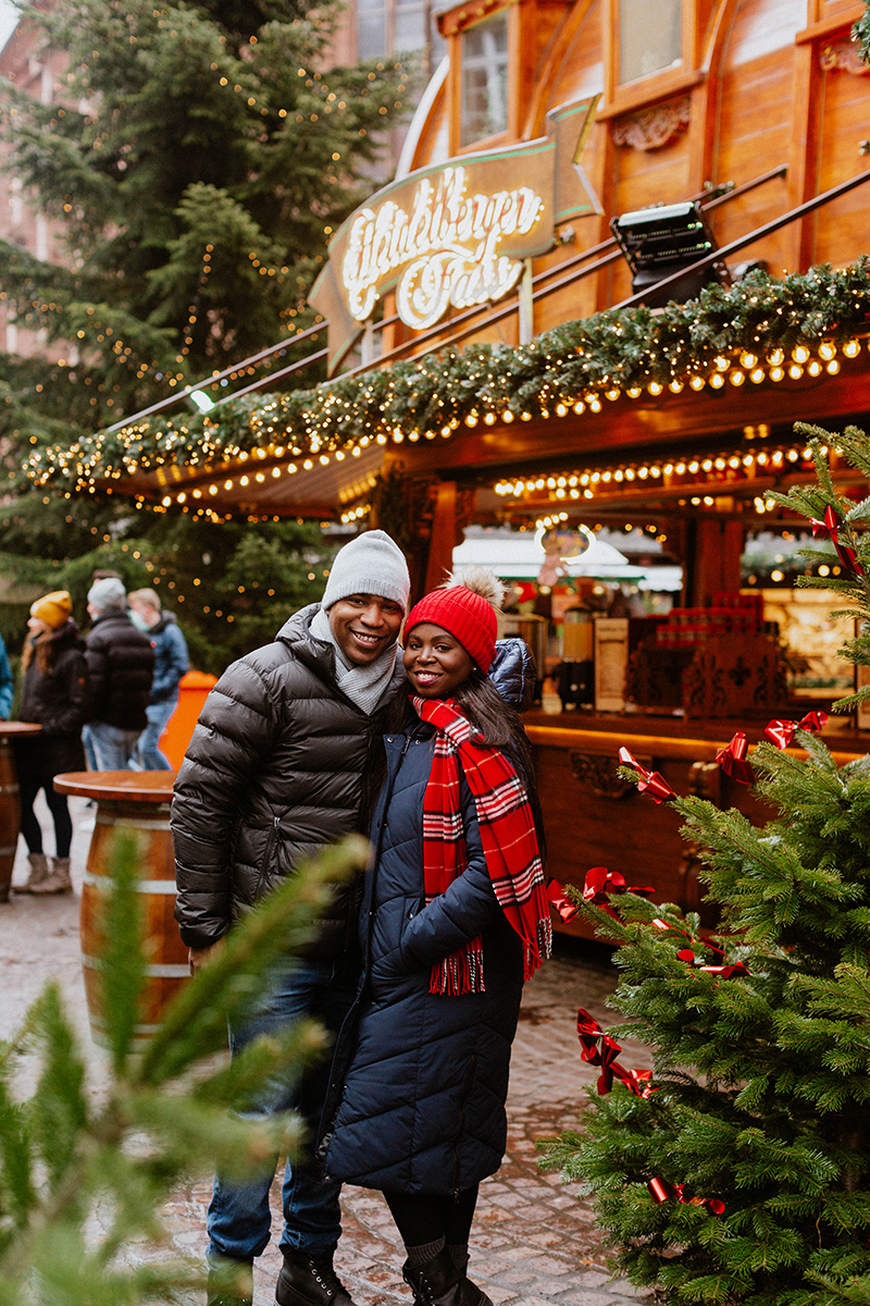 A couple poses together for this Heidelberg Christmas market photography mini sessions near Kaiserslautern, Germany