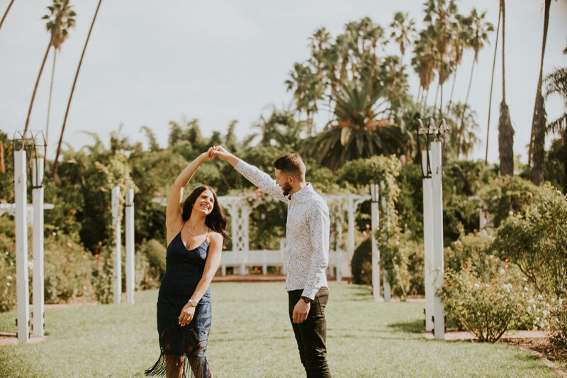 A couple dance together at the Los Angeles County Arboretum and Botanic Garden for this Los Angeles engagement photography session