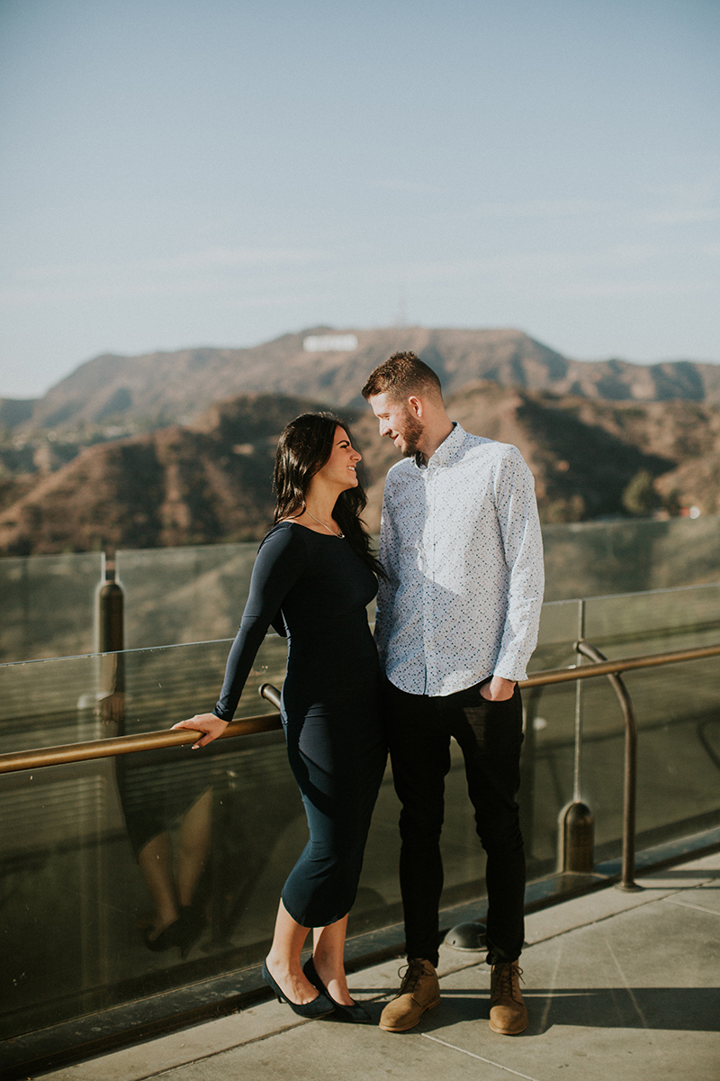 A couple hold each other at the Los Angeles Observatory for this Los Angeles engagement photography session