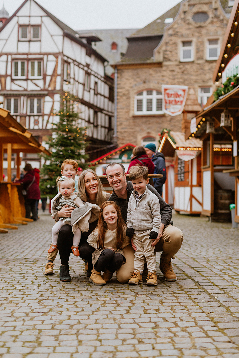A family poses for these Bernkastel-Kues Christmas mini sessions near Kaiserslautern, Germany